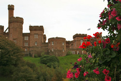 Inverness Castle with red flowers